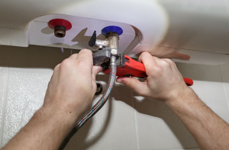Service Technician Inspecting Water Heater